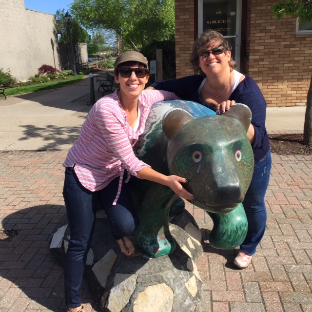 My Sis and I hug wrestling the famous Elk Rapids green bear!